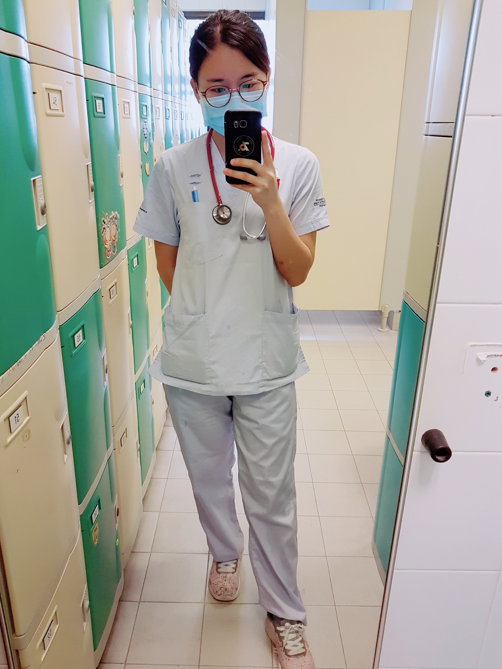 "Physiotherapist Chia Chia in her uniform at Singapore General Hospital (SGH), showcasing her extensive clinical experience before establishing Ocare Physio."